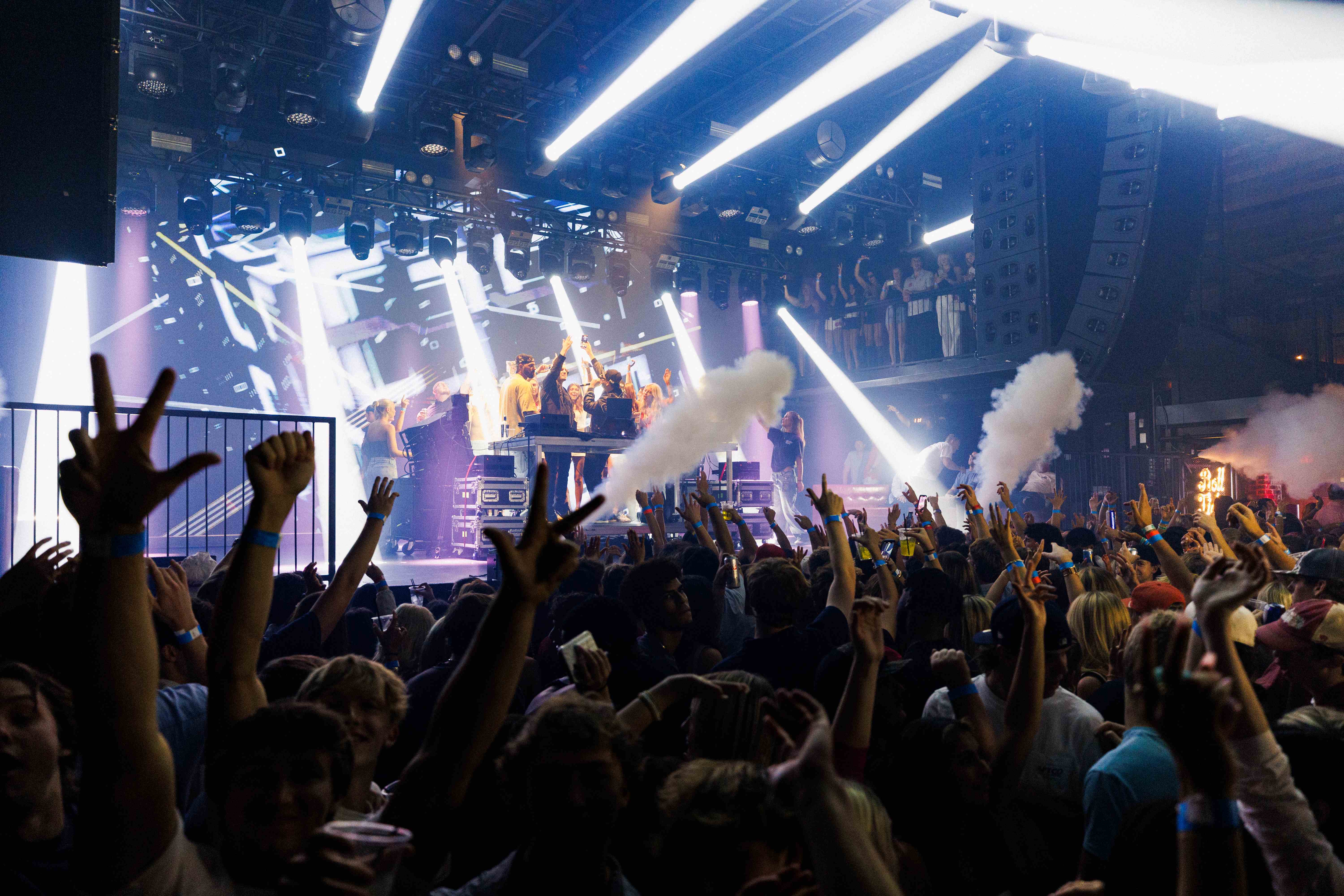 Wide crowd shot from stage perspective showing massive audience